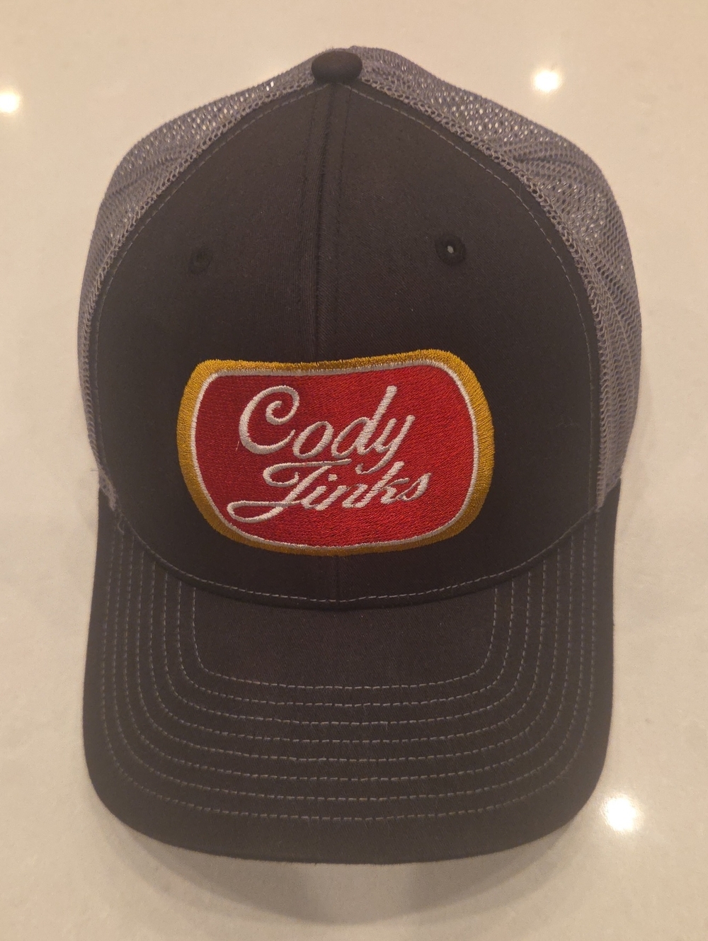 Cody Jinks Embroidered Trucker Hat - Gray with Red Patch